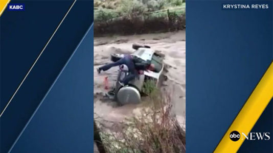 Video shows daring rescue of man trapped in overturned car