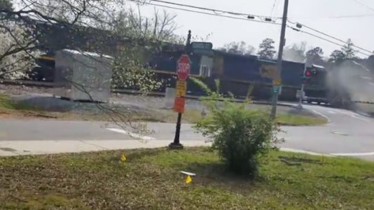 Caught on camera: Freight train slams into tractor-trailer in Georgia