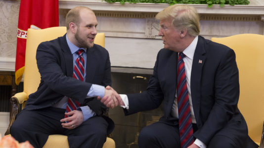 American man held for two years in Venezuela prison returns to the US with his new wife