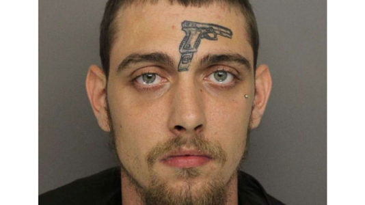 Man with gun tattoo on face arrested for gun possession