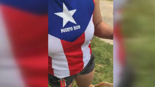 Man berates woman wearing a Puerto Rican T-shirt