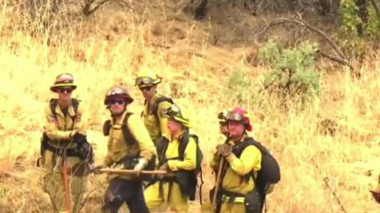 California firefighters make progress in battling deadly wildfire