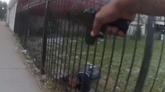 Chicago police fatally shot 24-year-old as he climbed a fence to flee, bodycam footage shows