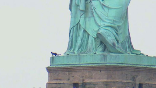Protester arrested after climbing base of Statue of Liberty