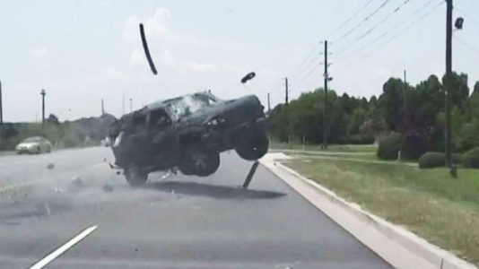 Dashcam video shows wild police chase end with car rolling and ejecting driver