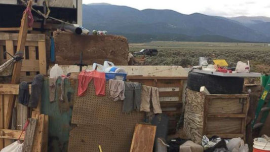 Remains of young boy found on filthy compound where authorities rescued 11 children
