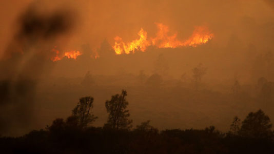Police arrest suspect linked to raging wildfire in California