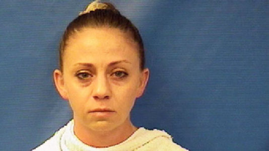 Officer arrested after killing man inside apartment she wrongly thought was her own home