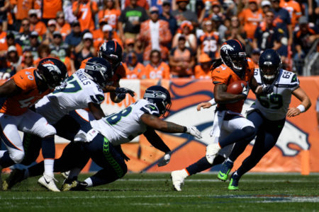 DENVER, CO - SEPTEMBER 9: Adam Jones (24) of the Denver Broncos runs with ball after making an interception during the first quarter against the Seattle Seahawks. The Denver Broncos hosted the Seattle Seahawks at Broncos Stadium at Mile High in Denver, Colorado on Sunday, September 9, 2018. (Photo by Andy Cross/The Denver Post)