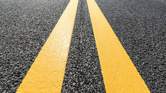 Father charged with neglect after photo of baby crawling in street goes viral