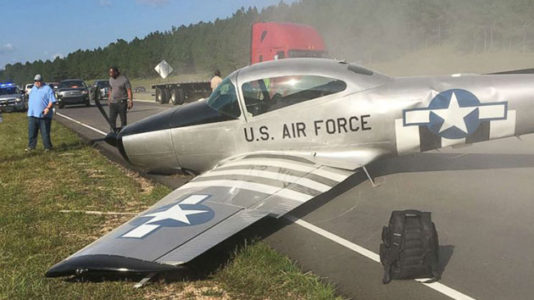 Vintage plane crash lands on highway in Mississippi