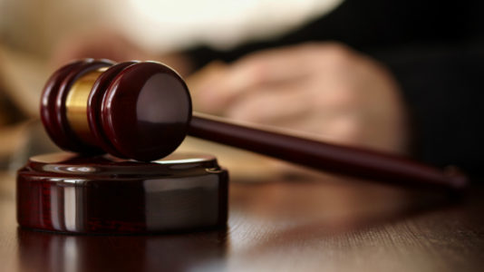 Synagogue shooting suspect pleads not guilty as funerals continue for the slain worshippers