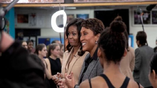 Michelle Obama surprises a dance class at her former high school
