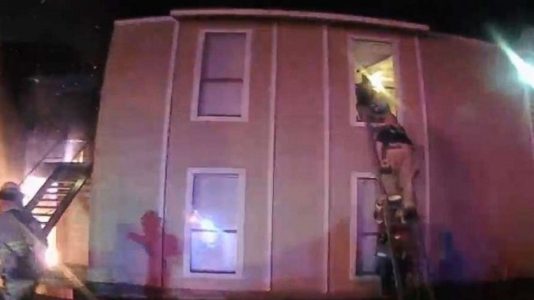 Dramatic video shows child jumping from burning apartment