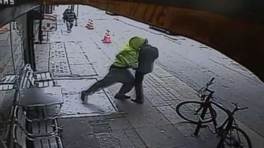 Man pushes random passerby in front of oncoming truck in downtown LA