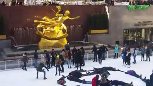 Nine arrested for ‘die-in’ protest at Rockefeller Center ice skating rink in New York City