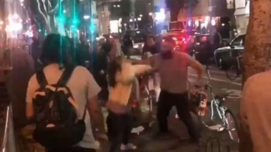 Police arrest suspect caught on video punching two women at food cart