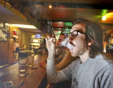 Sitting at the bar of Murphy's  at 160 So. Main Street in Salt Lake,  Finley Armstrong (front) and Steve Fugitt  take drags on what could be one of their last cigarettes  smoked  in a bar on  Friday, December 26, 2008.  A new law goes into effect on the first of January banning smoking in bars.Paul Fraughton / Salt Lake Tribune