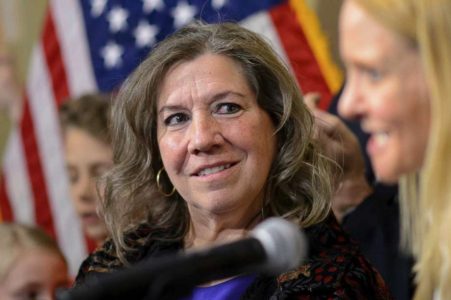 Teacher who asked student to wipe off cross returns to work