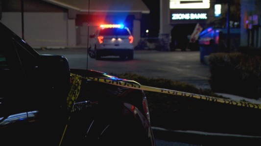 Woman run over by police car in strip mall parking lot