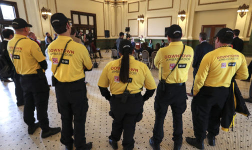 Downtown street ambassadors listen as Peggy Hostetter, long-time resident at The Gateway, says she as noticed the improvement in safety in her area as two new reports confirming that The Gateway and the Rio Grande area of downtown Salt Lake City have realized a dramatic decrease in crime. The reports were announced during a press conference at the Grand Hall at The Gateway in Salt Lake City on Tuesday, April 2, 2019. The Downtown Alliance, Salt Lake City and Visit Salt Lake partnered to launch the ÒDowntown Street Ambassador ProgramÓ in spring 2018. The program deploys as many as eight ambassadors in major pedestrian thoroughfares throughout the year. The goal is to create an even more welcoming and safe city center for residents and visitors.