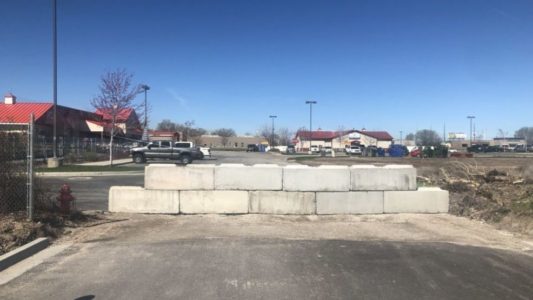 Students, farm supply store battle over access to road