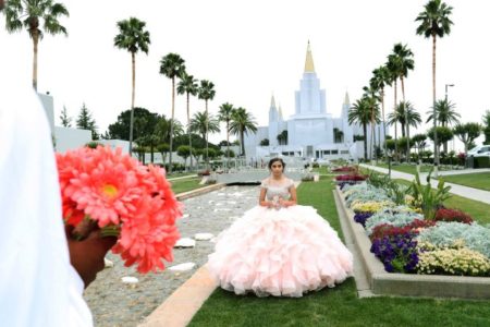 eOAKLAND, CALIFORNIA - JUNE 15: Quincea–era Joseline Garcia, of Oakley, poses during a photo session with photographer Javier Urbina at the Mormon Temple garden in Oakland, Calif., on Saturday, June 15, 2019. Quincea–era is a Latin American Catholic tradition celebrated for girls on or near their 15th birthday. Many quincea–eras come to have their photo session at the Mormon Temple garden, which has welcome them for years. (Ray Chavez/Bay Area News Group)