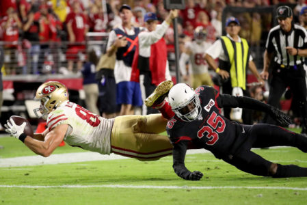 GLENDALE, ARIZONA - OCTOBER 31: Tight end George Kittle #85 of the San Francisco 49ers completes a reception over safety Deionte Thompson #35 of the Arizona Cardinals of the Arizona Cardinals the game at State Farm Stadium on October 31, 2019 in Glendale, Arizona. (Photo by Christian Petersen/Getty Images)