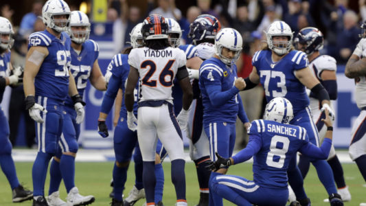 Indianapolis Colts kicker Adam Vinatieri (4) reacts with punter Rigoberto Sanchez (8) after kicking the winning field goal during the second half of an NFL football game against the Denver Broncos, Sunday, Oct. 27, 2019, in Indianapolis. (AP Photo/Darron Cummings)