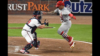 Cardinals score 4 in 9th, hold off Braves 7-6 in NLDS opener