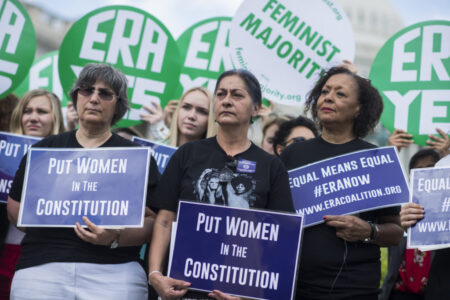 UNITED STATES - JUNE 6: Jessica Lenahan, center, a domestic violence survivor, and Carol Jenkins, right, of the Equal Rights Amendment Task Force, attend a news conference at the House Triangle on the need to ratify the Equal Rights Amendment on June 6, 2018. (Photo By Tom Williams/CQ Roll Call)