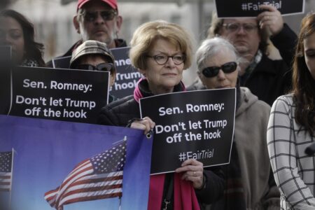 Demonstrators Call for Romney, Lee to Support Fair Trial