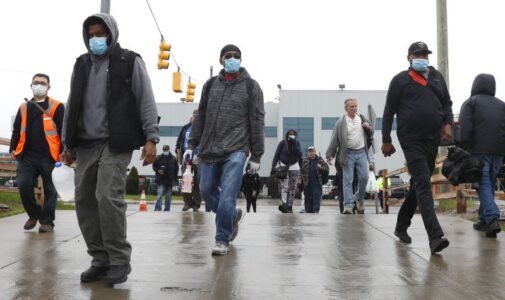 US autoworkers return, while possible vaccine shows promise