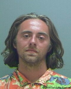 This photo provided by Salt Lake County Sheriff's Office shows Connor Peebles. A third person has been charged in the destruction of a Salt Lake City police car set on fire during protests over the death of George Floyd. Connor Peebles, 21, of Belmont, Michigan, helped flip the vehicle onto its roof Saturday May 30, 2020, prosecutors said in court documents. Peebles was charged Wednesday, June 3, 2020, with felony counts of criminal mischief and rioting. (Salt Lake County Sheriff's Office, via AP)