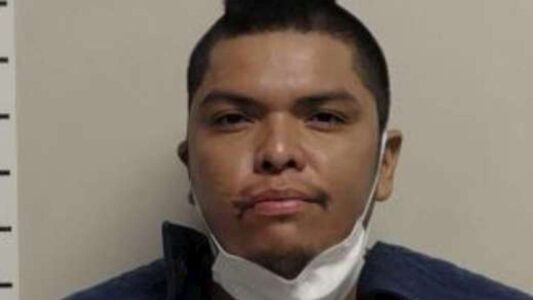 Man accused of assaulting woman after positive COVID test