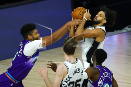 Utah Jazz' Juwan Morgan (16), fouls San Antonio Spurs' Derrick White during second half of an NBA basketball game Friday, Aug. 7, 2020, in Lake Buena Vista, Fla. (Kevin C. Cox/Pool Photo via AP)