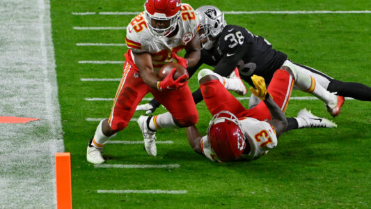 Kansas City Chiefs running back Clyde Edwards-Helaire (25) runs for a touchdown against Las Vegas Raiders strong safety Jeff Heath (38) during the second half of an NFL football game, Sunday, Nov. 22, 2020, in Las Vegas. (AP Photo/David Becker)