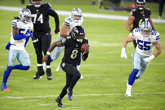 Baltimore Ravens quarterback Lamar Jackson (8) runs with the ball while scoring a touchdown on a keeper against the Dallas Cowboys during the first half of an NFL football game, Tuesday, Dec. 8, 2020, in Baltimore. (AP Photo/Nick Wass)