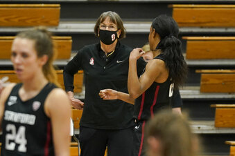 Stanford head coach Tara VanDerveer talks with Stanford guard Kiana Williams during a break in the action against Pacific in the first half of an NCAA college basketball game in Stockton, Calif., Tuesday, Dec. 15, 2020. With a win over Pacific, VanDerveer will become the winningest women's coach in history breaking Pat Summitt's record of 1,098. (AP Photo/Rich Pedroncelli)