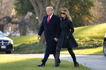 President Donald Trump and first lady Melania Trump walk to board Marine One on the South Lawn of the White House, Wednesday, Dec. 23, 2020, in Washington. (AP Photo/Evan Vucci)