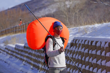 Cameron French, from White Pine Touring, wears an Ascent 40 AVABAG avalanche backpack on Dec. 18, 2020, in Park City, Utah. With another ski season getting underway, avalanche forecasters and search-and-rescue groups are concerned that large numbers of skiers and snowboarders will again turn to the backcountry to avoid crowds and reservation systems at resorts. The increased interest in the backcountry has been a lifeline for the outdoor retail industry amid the pandemic, but it has also renewed a push among gear manufacturers and stores to sell responsibly. (AP Photo/Rick Bowmer)