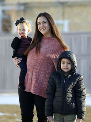 Evi Figgat, center, poses with daughter Elinor and son Oliver at their Eagle Mountain, Utah, home on Wednesday, Feb. 17, 2021. (Laura Seitz/The Deseret News via AP)