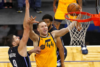 Utah Jazz forward Bojan Bogdanovic (44) is fouled by Orlando Magic center Nikola Vucevic (9) in the second half during an NBA basketball game, Saturday Feb. 27, 2021, in Orlando, Fla. (AP Photo/Joe Skipper)