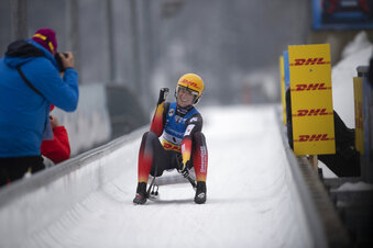 Natalie Geisenberger of Germany smiles in the finish area after the women's race at the Luge World Championships in Koenigssee, Germany, Sunday Jan. 31, 2021. (AP Photo/Andreas Schaad)