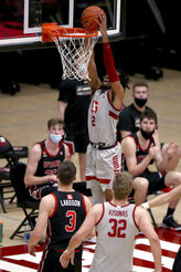 Stanford guard Bryce Wills (2) dunks in front of Utah guard Pelle Larsson (3) during the first half of an NCAA college basketball game Saturday, Feb. 13, 2021, in Stanford, Calif. (AP Photo/Scot Tucker)