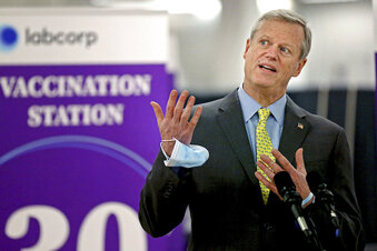 FILE - In this Feb. 24, 2021, file photo, Massachusetts Gov. Charlie Baker speaks at a mass coronavirus vaccination site at the Natick Mall in Natick, Mass. A year of battling the spread of the coronavirus has taken a political toll on Baker as he faces slumping popularity. (Matt Stone/Boston Herald via AP, Pool, File)