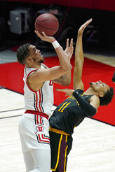 Utah forward Timmy Allen, left, shoots as Arizona State guard Alonzo Verge Jr. (11) defends in the first half during an NCAA college basketball game Saturday, March 6, 2021, in Salt Lake City. (AP Photo/Rick Bowmer)