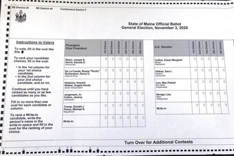 FILE - This absentee ballot for the 2020 Maine general election, photographed on Thursday, Oct. 22, 2020 in Falmouth, Maine, shows how Maine voters are allowed to rank presidential and senate candidates in order of ranked choice preference. An electoral reform that has taken root in the iconoclastic states of Maine and Alaska could be gaining traction nationwide. After decades of theoretical discussions among policy wonks, advocates of ranked-choice voting are looking to expand the concept. (AP Photo/David Sharp)