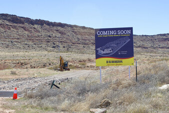 In this March 28, 2021, photo, a D.R Horton's developer's sign is posted at the existing exit for Long Valley Road showing plans for a new 2,100 single family homes and townhomes subdivision along the Southern Parkway near Sand Hollow Reservoir in Washington County, Utah. Conservationists are fighting plans to extend Long Valley Road south into desert tortoise habitat to provide a second entrance to the subdivision. (Joan Meiners/The Spectrum via AP)