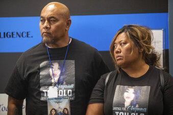 In this June 17, 2020 photo, the parents of Lopine "Chynna" Toilolo, Sefu Toilolo, left, and Terri Toilolo, stand before the media, at the Weber County Sheriff's Office in Ogden, Utah. Andy Dane Oketang Dennis was arrested for the murder of "Chynna" Toilolo, whose body was found near the Ogden River. (Ben Dorger/Standard-Examiner via AP)